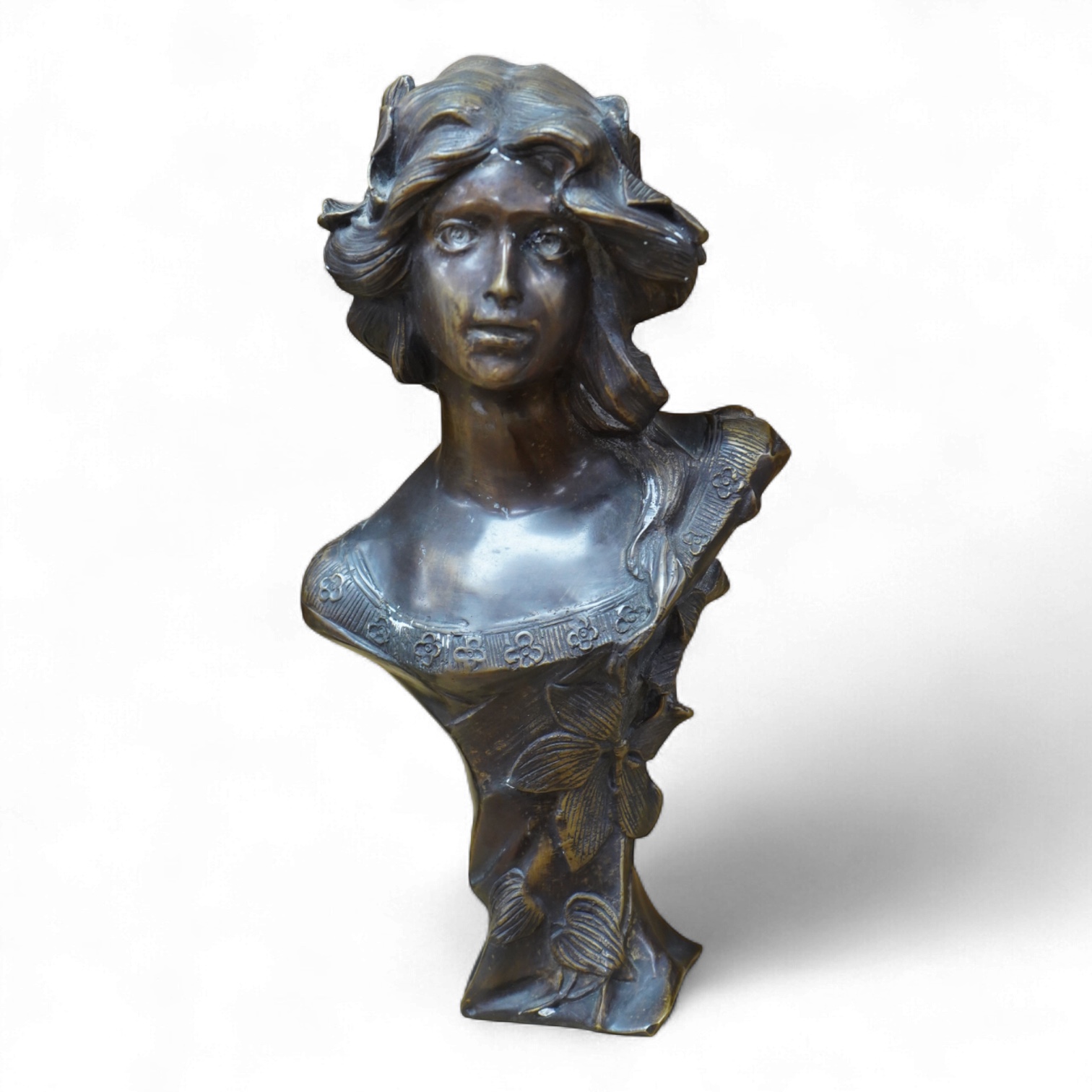 A French Art Nouveau bronze bust of a maiden, unsigned, 32cm high